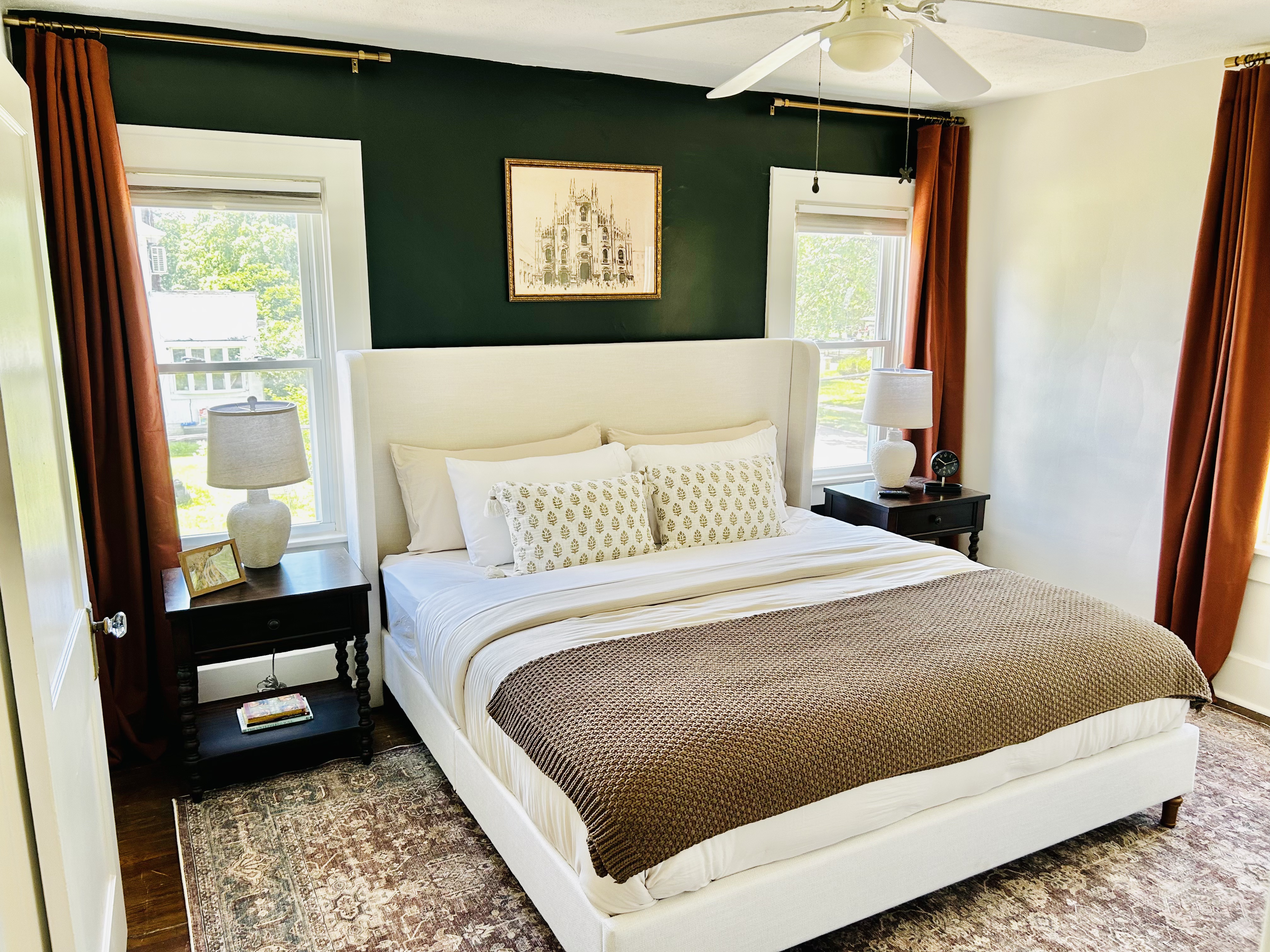 The Mac House — master bedroom with green accent wall